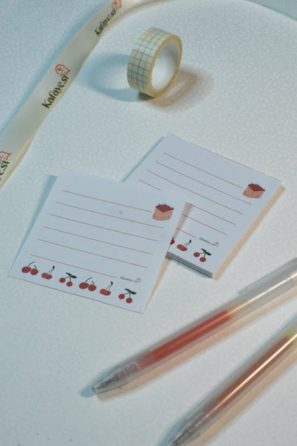 Decorative tape, stationery items, and pens on a light surface