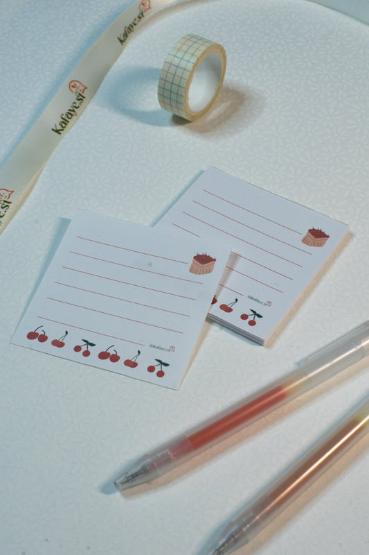 Decorative tape, stationery items, and pens on a light surface